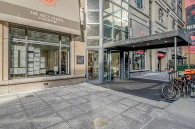 a building with bikes parked outside of a store at Modern Bright Times Sq 1BR w Indoor pool NYC-8 in New York