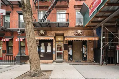 a building on the corner of a city street at Convenient 2BR - Walking distance to Times Square in New York