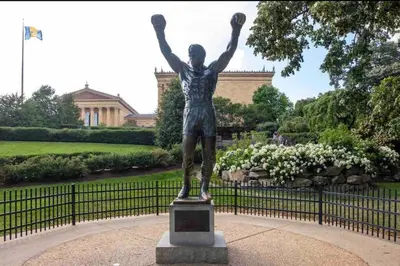 a statue of a man with his arms in the air at 505 Relaxing 1BR apartment in center city of Philly in Philadelphia