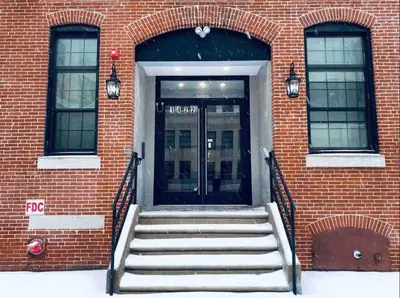 a door to a building with stairs in front at 305 Cozy and lovely 1BDR apartment in Center City in Philadelphia