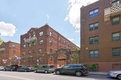a brick building with cars parked in front of it at Lennox C402 Peaceful & Perfect Private 1-Br in Philadelphia