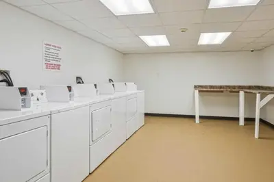 a large room with white washing machines in it at Lennox C301 Peaceful & Perfect Studio Apt in Philadelphia