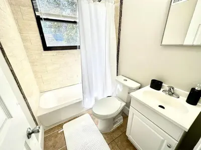 a bathroom with a toilet and a sink and a shower at Lennox C301 Peaceful & Perfect Studio Apt in Philadelphia