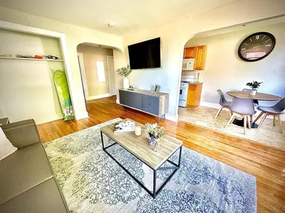 a living room with a coffee table and a dining room at Lennox C407 Cozy and Spacious Studio1br Apt in Philadelphia