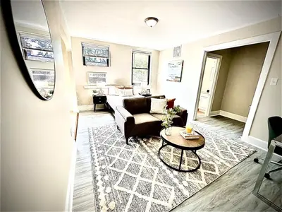 a living room with a couch and a table at Lennox C405 Peaceful & Perfect Studio Apt in Philadelphia