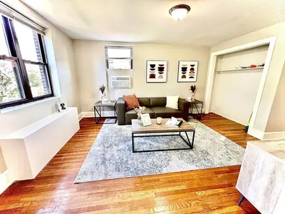 a living room with a couch and a table at Lennox C303 Peaceful, Perfect Private Studio1br in Philadelphia