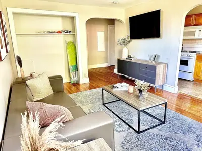 a living room with a couch and a tv at Lennox C304 Peaceful & Perfect Private 1-br in Philadelphia