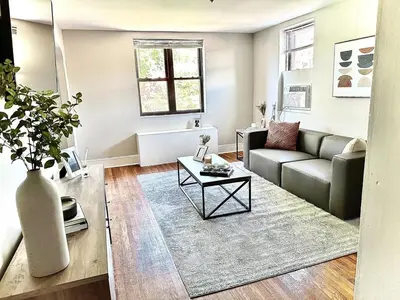 a living room with a couch and a table at Lennox C409 Peaceful & Perfect Private 1-Br in Philadelphia