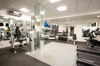 a gym with treadmills and machines in a room at Kips Bay 1br w gym nr empire state building NYC-1214 in New York