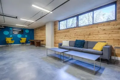 a living room with a couch and a table at Avenue A909 Comfy 2Br, Pool, Gym, Parking in Philadelphia