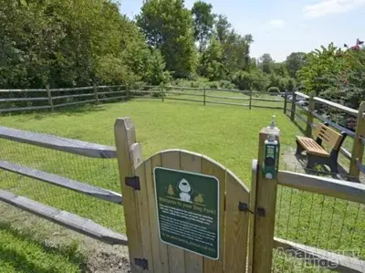 a fence with a sign in front of a field at pb 1112 Furnished 2br with Parking, gym, in Newark