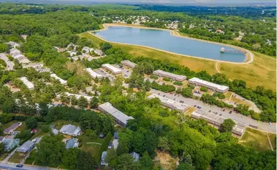 an aerial view of a park with a lake at Pine Brook 804 I Pool Gym I Free Parking ! in Newark