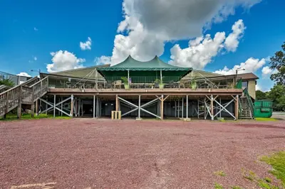 a large building with a green roof at Mango Mountain House Pocono in Albrightsville