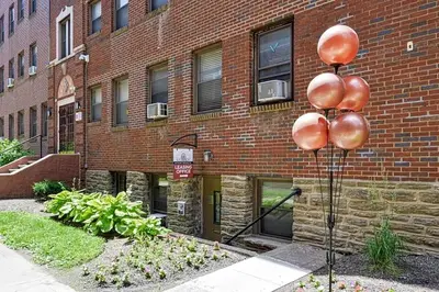 a metal pole in front of a brick building at Lennox B405 Peaceful & Perfect Studio Apt in Philadelphia