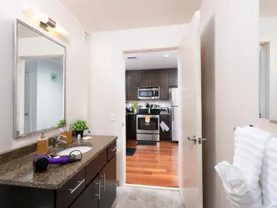 a kitchen with a sink and a mirror at Furnished Apartment near Rittenhouse Square apts in Philadelphia