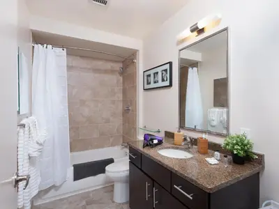 a bathroom with a sink and a toilet and a mirror at Furnished Apartment near Rittenhouse Square apts in Philadelphia