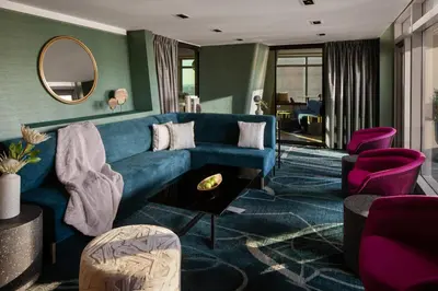 a living room with a blue couch and purple chairs at Financial District 1br w WD gym elevator NYC-1362 in New York