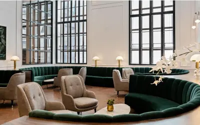 a living room with green couches and chairs at FiDi jr 1br w game room resident-only bar NYC-1336 in New York