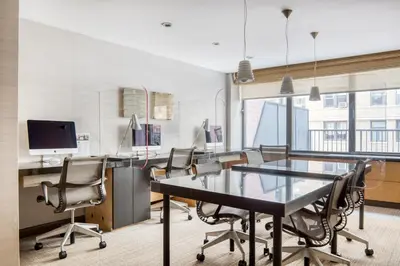 an office with a conference room with a table and chairs at Upper West Side 2br w rooftop gym nr park NYC-1216 in New York