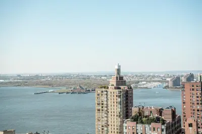 a view of a city with a river and a building at Financial District 1br w WD gym elevator NYC-1368 in New York