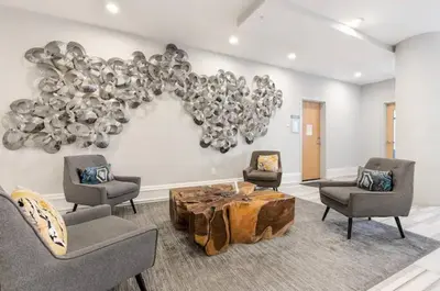 a living room with chairs and a table and a balloon at XL Studio - Premier Studio with Gym Access in Philadelphia