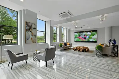 a living room with a dog laying on the floor at XL Studio - Premier Studio with Gym Access in Philadelphia