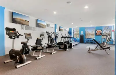 a gym with several treadmills and cardio machines at XL Studio - Premier Studio with Gym Access in Philadelphia