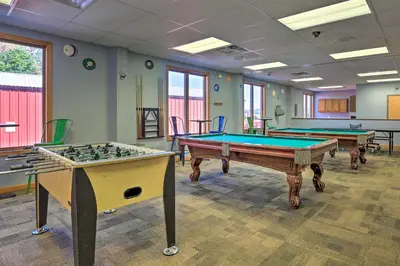 a room with two pool tables in it at Arrowhead Lake Access Cabin with Resort Amenities in Pocono Lake