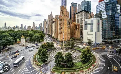 a busy city street with traffic in a city at Oasis Room at a Shared Apartment by Times Square in New York