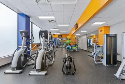 a gym with cardio bikes and treadmills at PP 1114 Beautiful Professional 1br Apt, Pool in Harrisburg