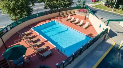 an overhead view of a swimming pool with chairs and umbrellas at PP 1801 Modern Corporate 2br, pool, Gym in Harrisburg