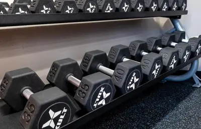 a bunch of dumbbells on a shelf at PP 2114 Professional 2br apt, Near Hospitals in Harrisburg