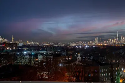 a view of a city at night with lights at Rosy Retreat with NYC Views by the train, Free Parking, 3 beds, 20 Percent OFF 7 days in Newark