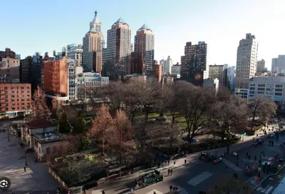 a view of a city with people walking in a park at Heart of Downtown Manhattan - Stylish One Bedroom Apartment in Vibrant Union Square in New York