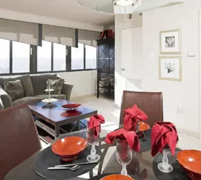 a dining room with a table and a couch at PP 1009 Beautiful Corporate 2br Apt, Pool in Harrisburg
