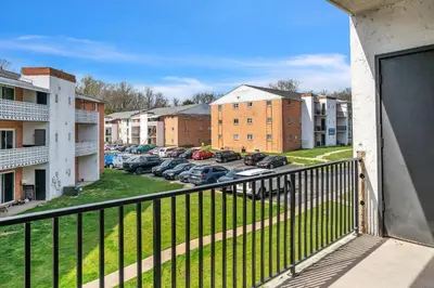 a balcony with a view of a parking lot at Luxurious 2-bedroom Apartment In Wilmington in Wilmington