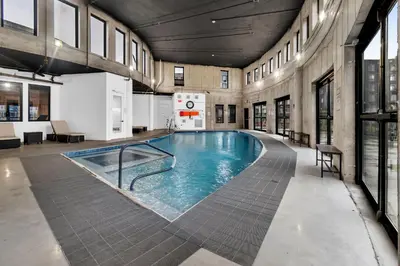 a large swimming pool in a building at Pink Heaven Indoor Pool, FREE Parking, Near NYC in Elizabeth