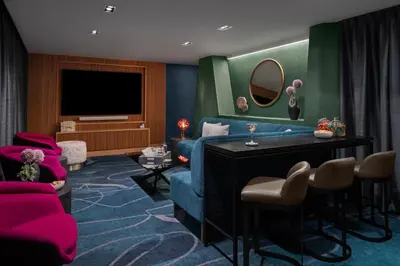 a living room with a blue couch and a tv at Tribeca 1br w doorman gym roof deck NYC-1374 in New York