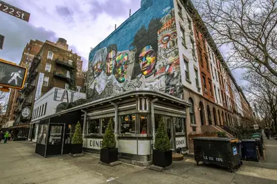 a building with a mural on the side of it at Chelsea 1br w roofdeck gym nr Flatiron NYC-1384 in New York