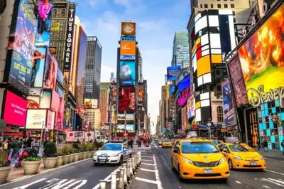 a busy city street with cars and buildings at 2 Days Stay Get 40 percent OFF for, Sleeps 6 & 2 Queen in Newark