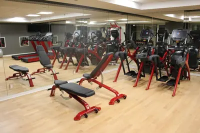 a gym with a bunch of exercise bikes at Beautiful Resort in Midtown 45 - Deluxe 1BD in New York