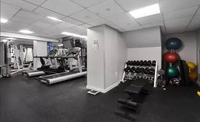 a gym with lots of exercise equipment and balloons at 73-1504 Newly Reno Studio UWS Doorman Gym Laundry in New York