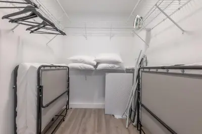 a room with two bunk beds in it at Opulence in Olive with Free Parking plus EV Plug, 2 BR 2 baths Suite, 5 beds and Sleeps 8 in Orange