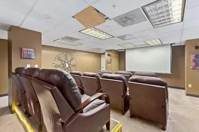 a conference room with brown leather chairs and a whiteboard at PP 1306 Modern Corporate 1br, pool, Gym in Harrisburg
