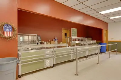 a cafeteria with a row of sinks and counters at Community Perks Elk Creek Escape - Deluxe Cabin C in Hillsgrove