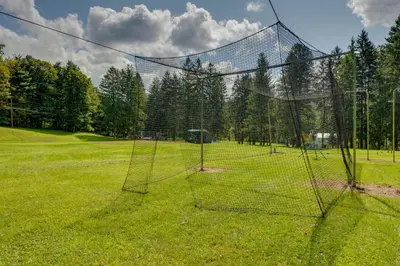 a net in the middle of a field at Shared Perks Deluxe Cabin B at Elk Creek Escape! in Hillsgrove