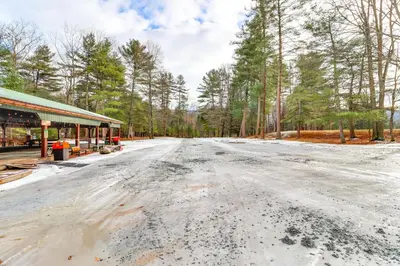 an empty road in front of a building at Hillsgrove Deluxe Cabin E Close to Hiking in Hillsgrove