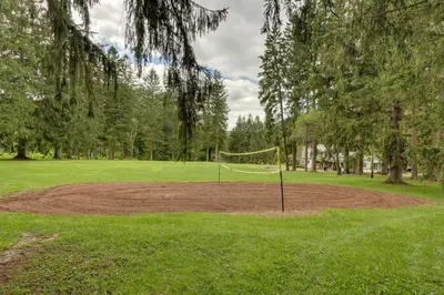 a park with a net in the middle of a field at The Big House at Elk Creek Escape with Game Room in Hillsgrove