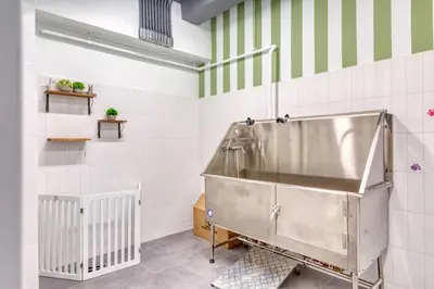 a shower in a bathroom with white and green stripes at Blueground Midtown gym elev nr Grand Central NYC-1479 in New York