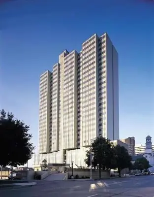 a large building with many windows in a city at PP 2312 Modern Corporate 1br, pool, Gym in Harrisburg